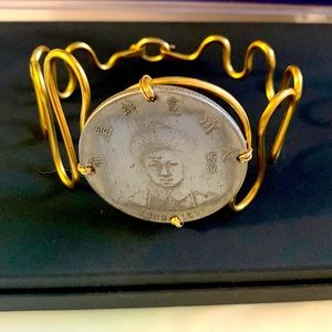 NWOT. Bracelet, genuine coin, twisted gold color hook closure Price firm